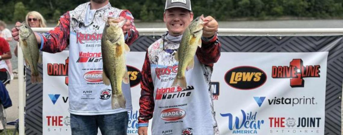 Two young fishermen at a fishing competition