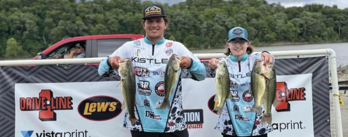 Two young fishermen at a fishing competition