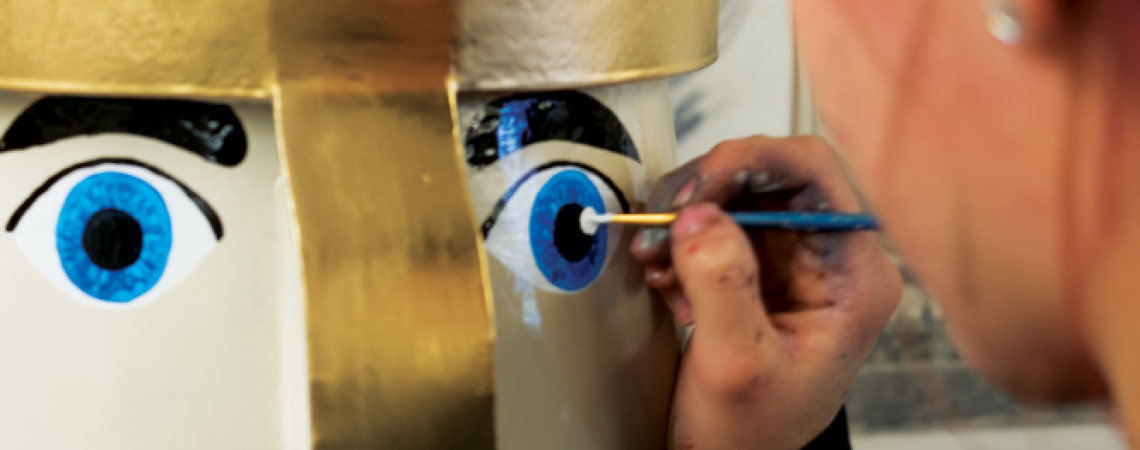 A life-sized nutcracker being painted by hand