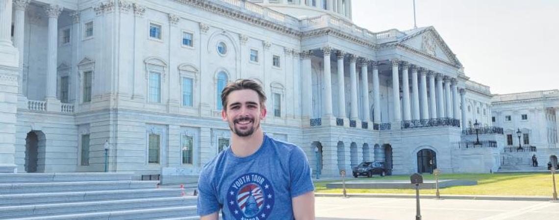 Kyle Hicks posing in front of the U.S. Capitol