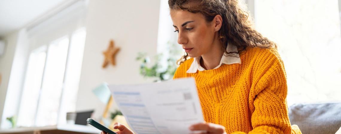 Woman looking at bills