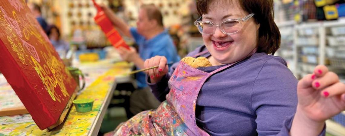 A young girl painting