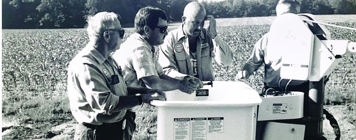 black-and-white photo of lineworkers