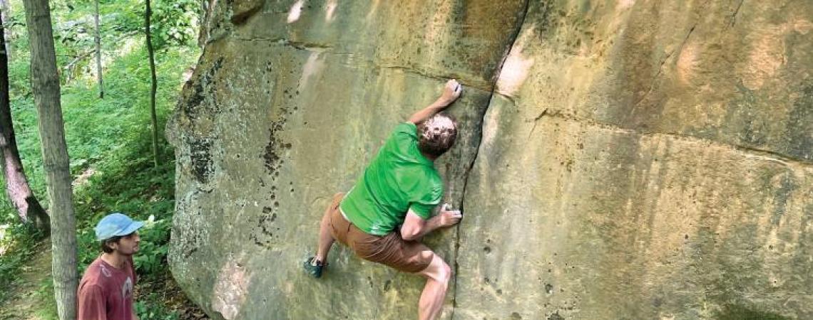 A man free solo climbing