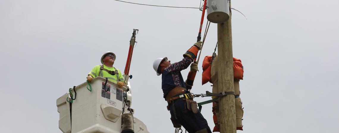 lineworker on pole