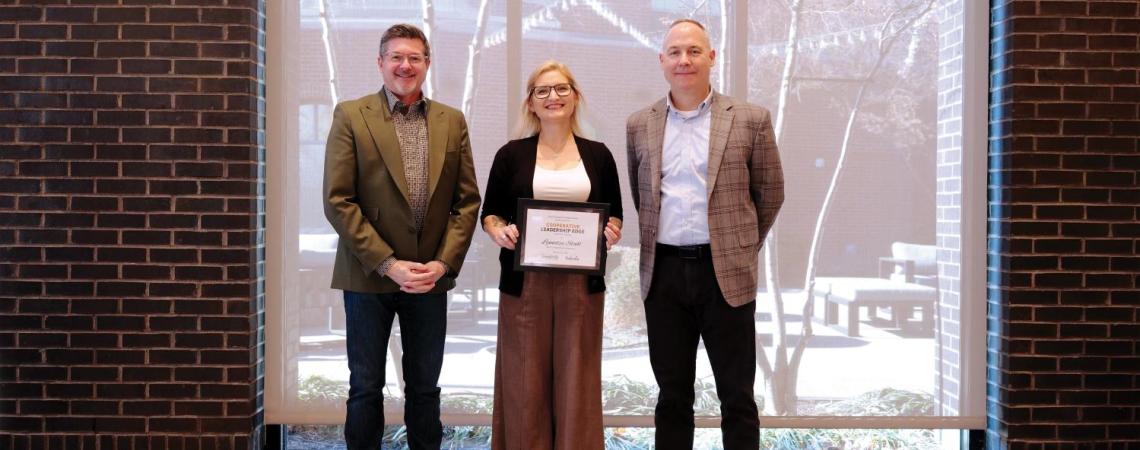 three people standing