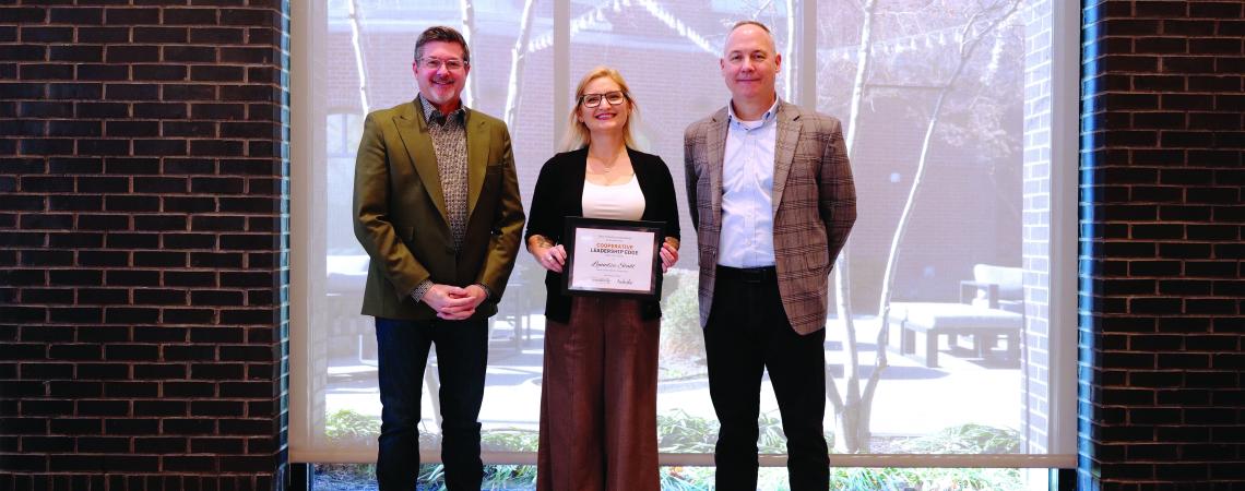 three people standing