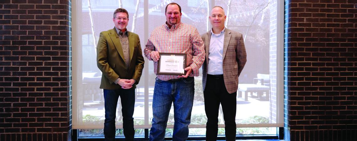 three people standing