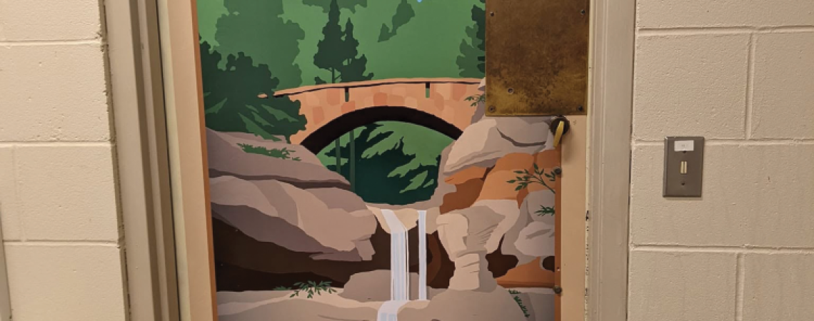 A mural on a restroom door