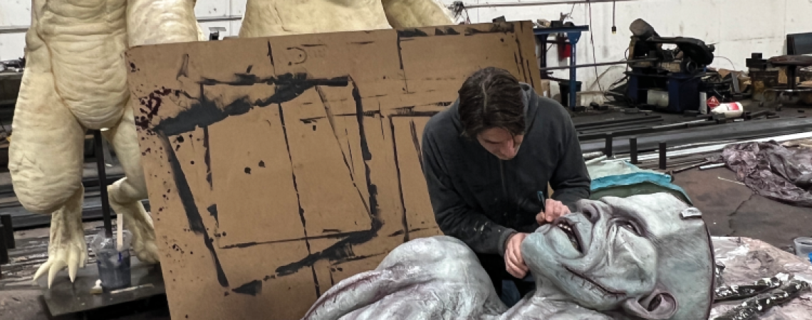 Bo Bruns working on a realistic haunted-attraction sculpture