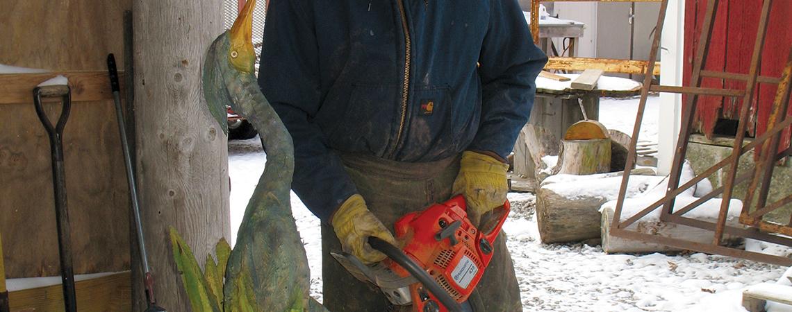 Tim Kuenning carving with chainsaw
